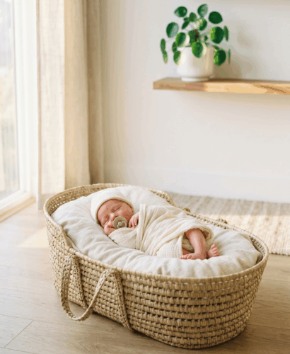 Newborn baby in woven basket for baby names that mean gift from God article