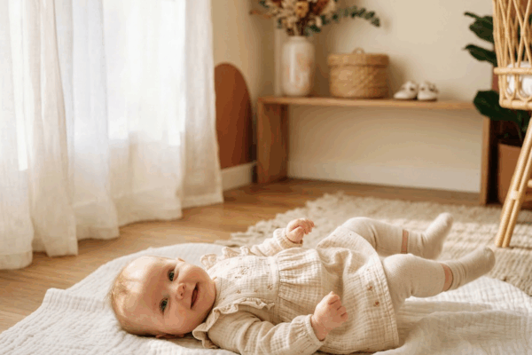 Adorable baby girl in warm sunlit nursery for Spanish baby names article