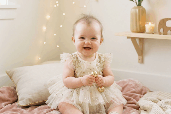 Adorable baby girl in a sparkly setting for Taylor Swift baby names article