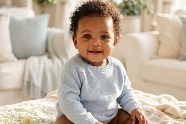 Baby Girl in a sunlit living space with white furnishings and afternoon light — 200+ Angelcore Baby Names With Celestial, Divine Energy