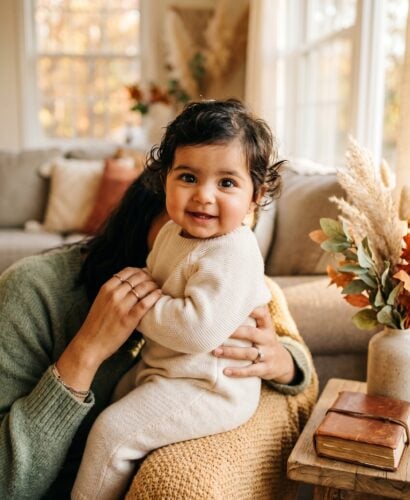Baby in a living room corner bathed in golden autumn afternoon light — Autumn Baby Names for a Fall-Born Little One