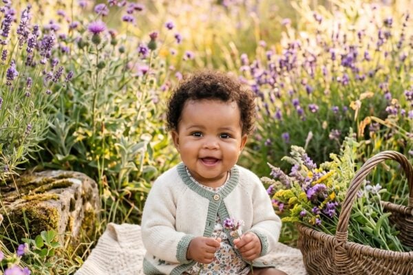 Baby Girl in a wildflower meadow with rustic cottage garden elements — 250+ Cottagecore Girl Names That Feel Like a Wildflower Field