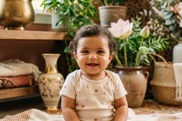 Baby Girl in a sun-filled room with gold accents, warm terracotta, botanical plants — 200+ Egyptian Mythology Baby Names — Mystical, Ancient, and Strikingly Beautiful