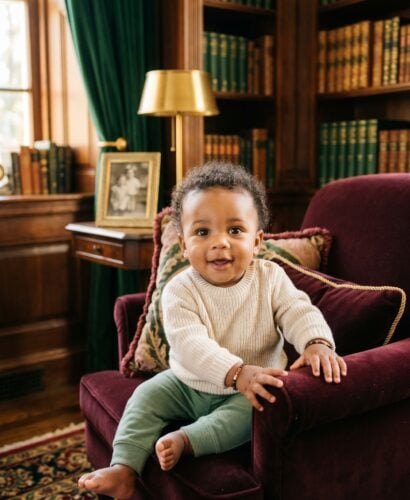Baby Boy in an elegant study with dark wood furnishings and jewel-tone textiles — 200+ Gothic Boy Names for the Dark, Dramatic Soul