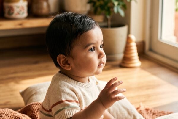 Baby Boy in a sun-filled living room with warm wood and natural textiles — 200+ Indian Baby Boy Names That Cross Languages and Generations