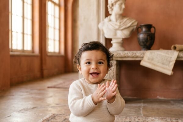 Baby Boy in a sunlit classical room with warm terracotta walls and arches — 200+ Latin Baby Boy Names Rooted in Ancient Rome