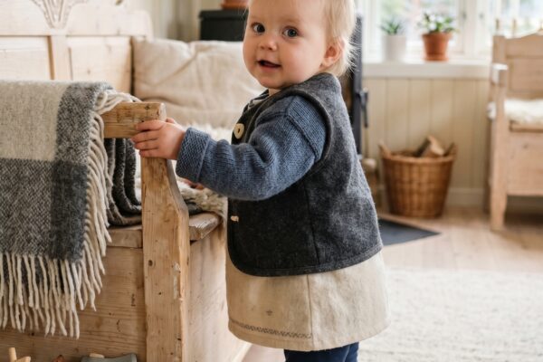 Baby Girl in a bright Scandinavian room with pale wood and cream walls — 189+ *Powerful* Norse Girl Names From Viking Lore