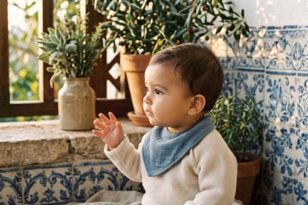 Baby Boy in a sun-drenched porch with Portuguese azulejo tiles and Mediterranean herbs — 200+ Portuguese Baby Boy Names From Lisbon to São Paulo