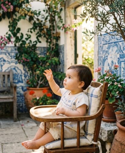 Baby Girl in a sun-drenched Mediterranean patio with Portuguese azulejo tiles — 200+ Portuguese Baby Girl Names With Romantic Lusophone Flair