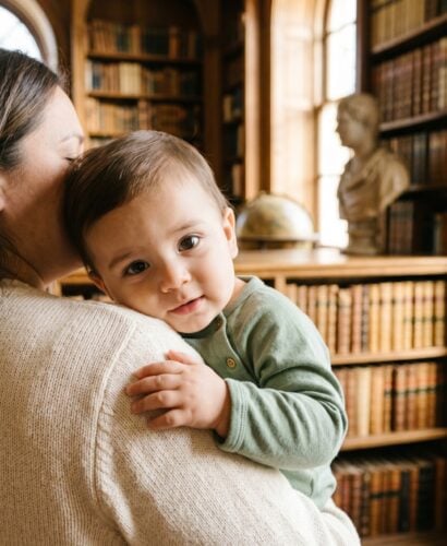 Baby Boy in a sunlit library with tall arched windows and wooden shelves — 200+ Saint Names for Boys — Faithful, Timeless, and Surprisingly Cool