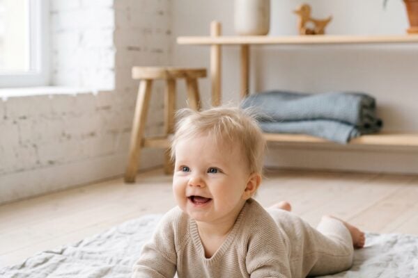 Baby Girl in a bright Nordic studio with white walls and pale wood elements — 200+ Scandinavian Baby Girl Names That Are Beautifully Strong