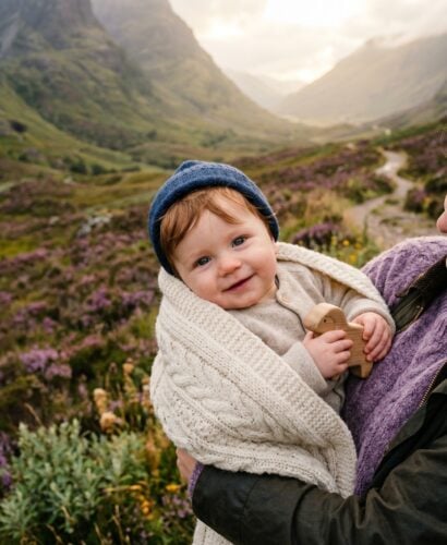 Baby Boy in a misty Scottish highland valley dotted with native purple heather — 200+ Scottish Baby Boy Names With Rugged Celtic Character