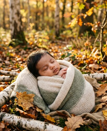 Baby in A forest edge with dappled golden light and autumn foliage — Wildwood Baby Names That Feel Like a Forest Walk