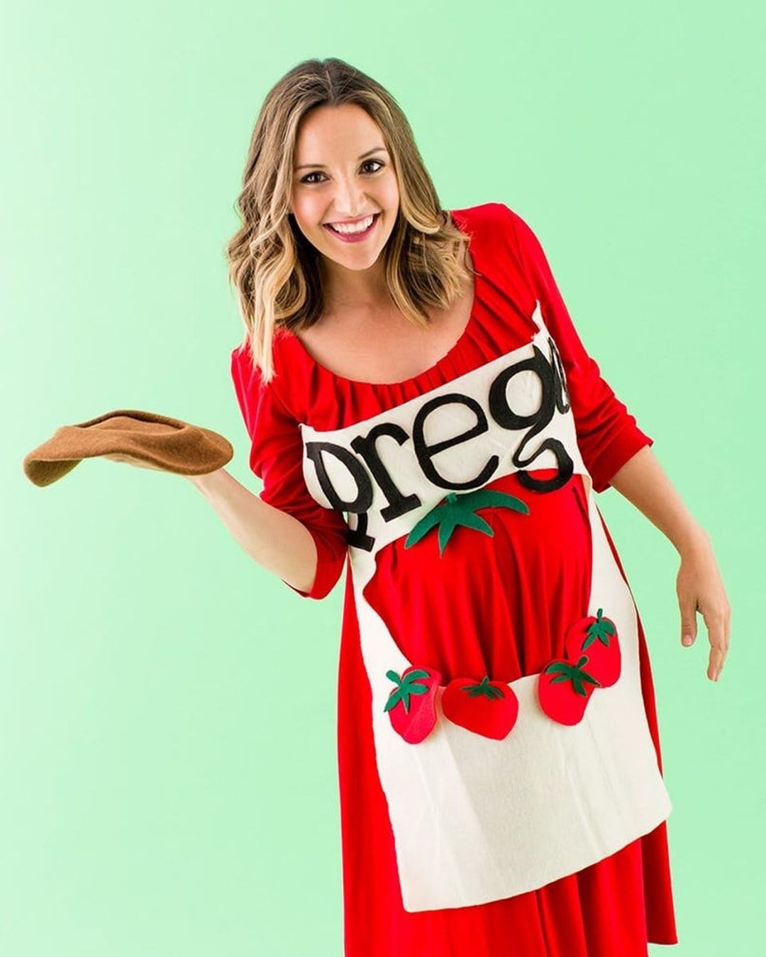 Pregnant belly decorated as a Prego spaghetti sauce jar
